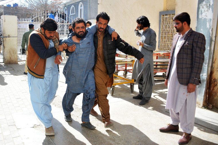 At least 22 people were killed Wednesday in two separate bomb blasts outside poll candidate offices in southwestern Pakistan, officials said, on the eve of an election marred by violence and allegations of poll-rigging.