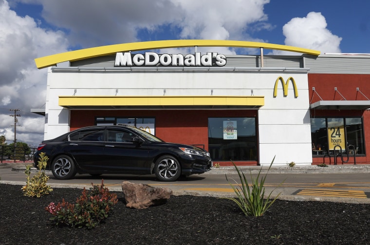 A car drives in front of a McDonald