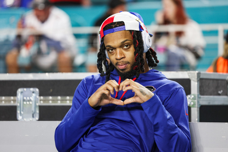 Damar Hamlin makes a heart-shaped-gesture with his hands