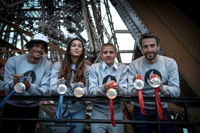 Olympics French sportsmen Arnaud Assoumani, Marie Patouillet, Sara Balzer and French President of the Paris Organising Committee of the 2024 Olympic and Paralympic Games Tony Estanguet