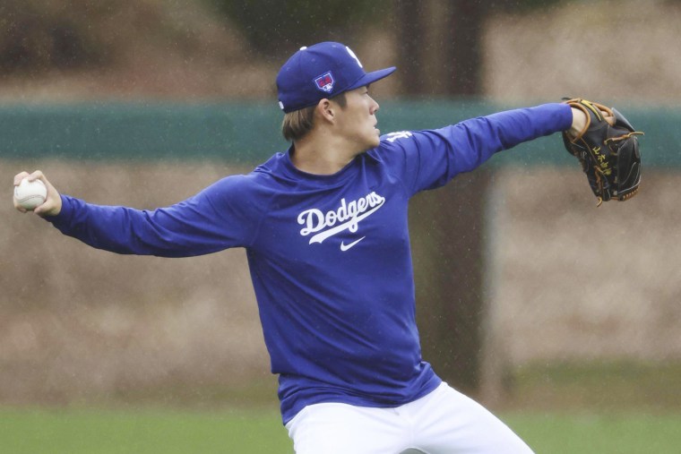 Los Angeles Dodgers pitcher Yoshinobu Yamamoto throws at the team's spring training site in Glendale, Ariz., on Feb. 8, 2024. 