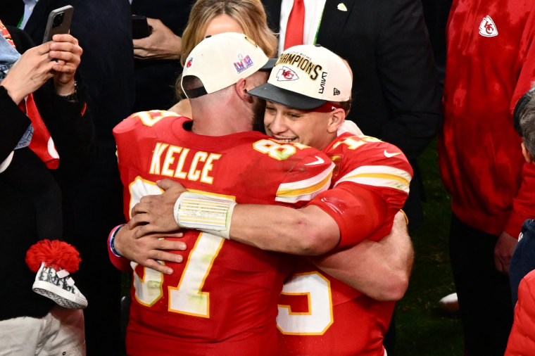 Kansas City Chiefs' tight end Travis Kelce and quarterback #15 Patrick Mahomes hug after winning the 2024 Super Bowl in Las Vegas on Feb. 11, 2024.