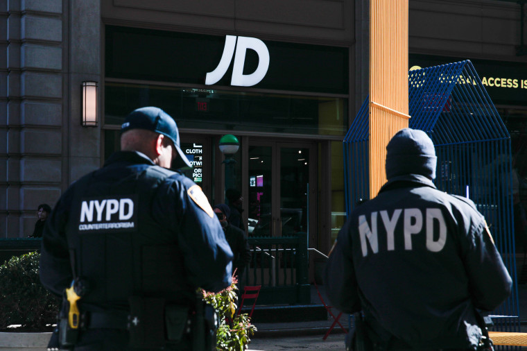 Police patrol outside the JD Sport store in Times Square on Friday.