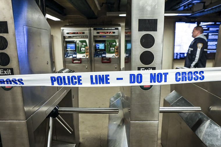 Image: New York Police walk through the Mount Eden subway station