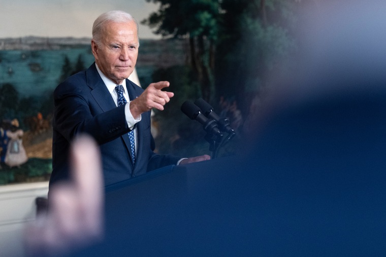 President Joe Biden responds to a question 