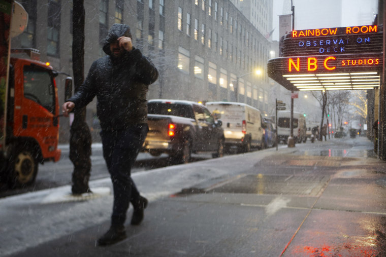 Snow falls in Midtown Manhattan on Feb. 13, 2024.
