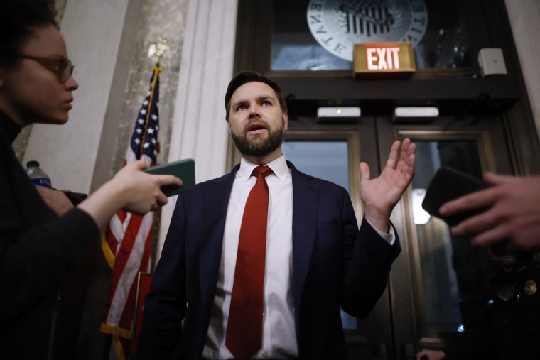 Sen. J.D. Vance (R-OH) talks to reporters between votes at the Capitol on Feb. 12, 2024. 