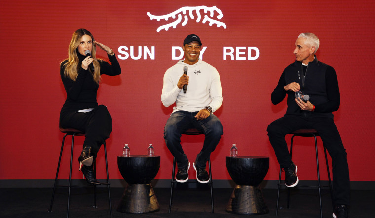 From left, Erin Andrews, Tiger Woods and David Abeles, CEO and president at TaylorMade, at the launch of "Sun Day Red" on Feb. 12, 2024 in Pacific Palisades, Calif.