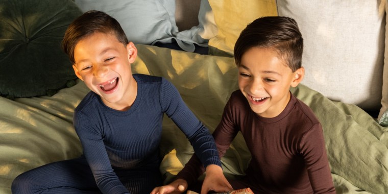 two little boys laughing and enjoying gifts for 8 year olds