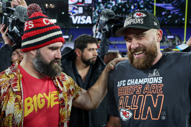 Travis Kelce celebrates with his brother Jason Kelce in Baltimore on Jan. 28, 2024.