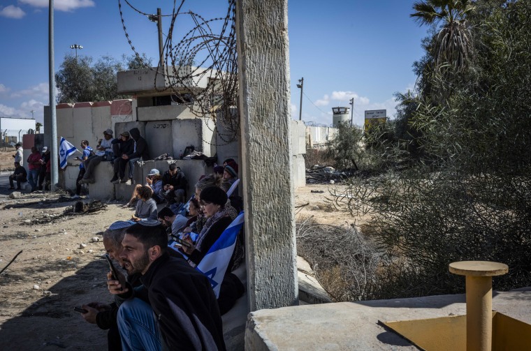 Israeli right-wing activists block the Nitzana Border Crossing between Israel and Egypt to prevent trucks with aid from entering the Gaza Strip on Feb. 14, 2024.