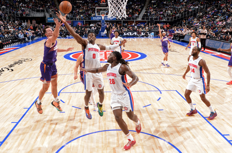 Isaiah Stewart #28 of the Detroit Pistons looks back as Drew Eubanks #14 of the Phoenix Suns grabs the rebound during a game on Oct. 8, 2023 at Little Cesars Arena in Detroit, Michigan.