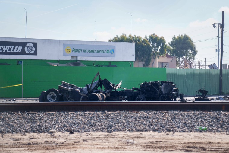 The damaged tractor portion of a big rig in Wilmington, Los Angeles, following a fuel tank explosion on Feb. 15, 2024.