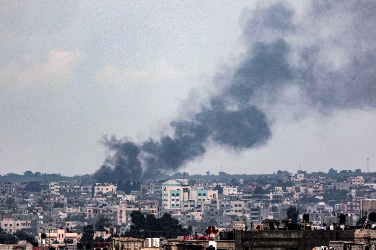 Smoke billows over Khan Younis, in southern Gaza, during Israeli bombardment on Feb. 18, 2024.