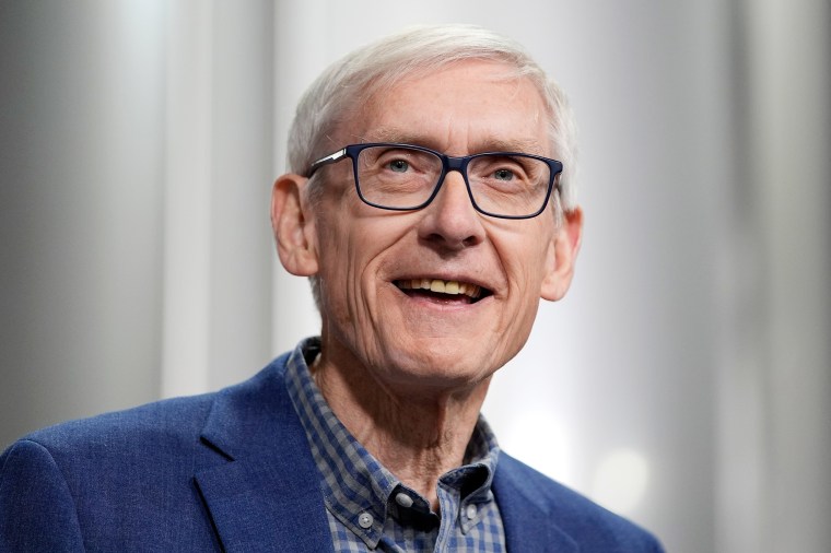 Gov. Tony Evers smiles.