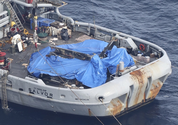 An aerial photo shows an object believed to be part of the US V-22 Osprey, which crashed on Nov. 29, on a U.S. salvage vessel in Yakushima Town, Kagoshima Prefecture in December 2023. 