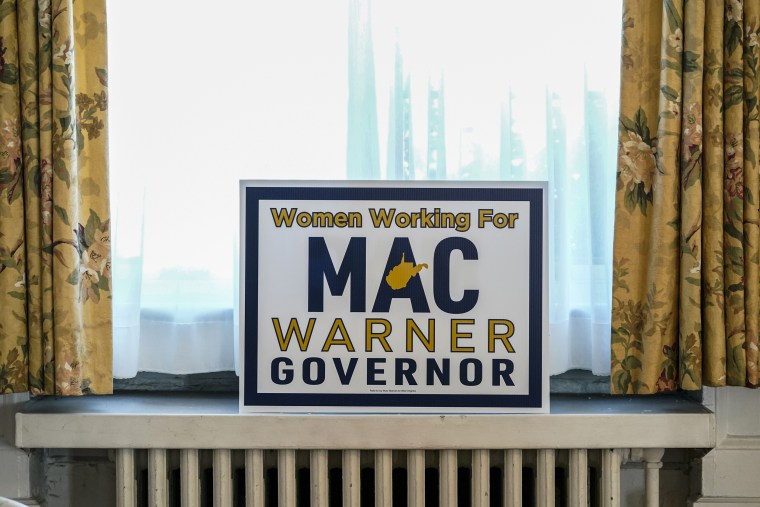 A sign is displayed at a campaign event for West Virginia gubernatorial candidate Mac Warner 