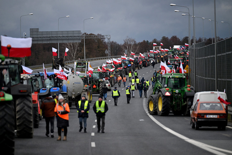 Polish farmers block the highway with their tractors and vehicles.