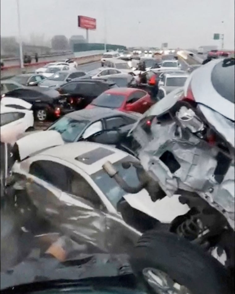 Cars pile up on an overpass during rainy and snowy weather, in Suzhou
