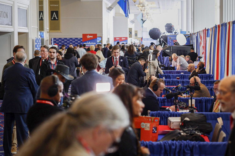 People walk around media row at the CPAC at the Gaylord National Resort Hotel and Convention Center on Feb 22, 2024.