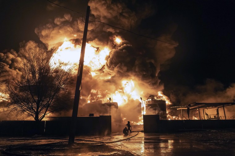 Firefighters extinguish a fire after a Russian attack on a residential neighborhood in Kharkiv, Ukraine, on Feb. 10.