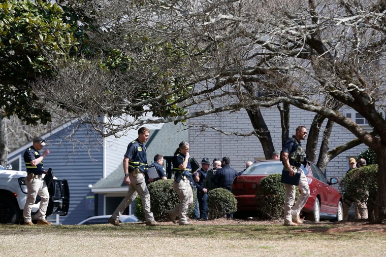 Officials search the Cielo Azulyk apartment complex.