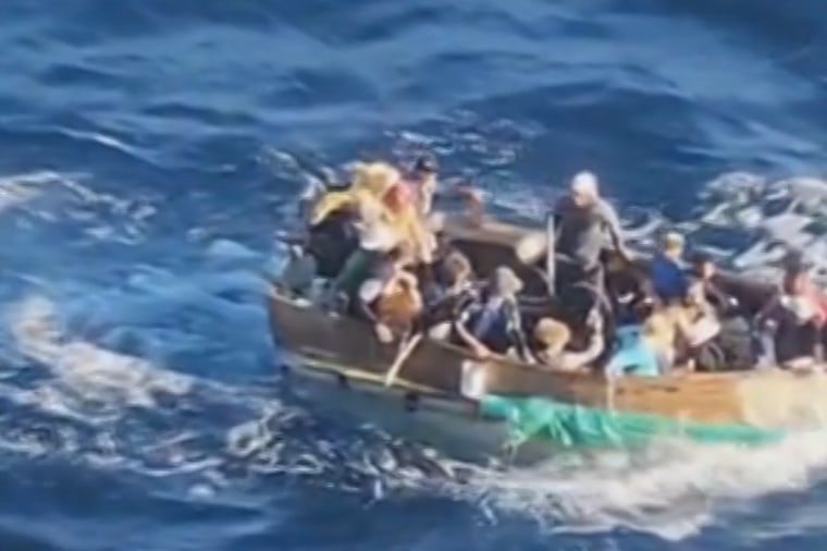 A Carnival cruise ship came to the aid of a group of migrants aboard a rustic vessel out at sea.