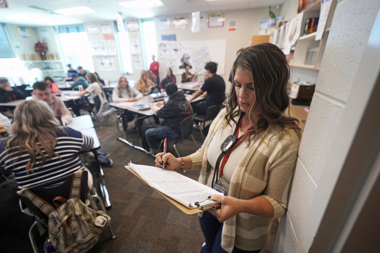 At the rural Utah school, there is a strict policy requiring students to check their phones at the door when entering every class. Each classroom has a cellphone storage unit that looks like an over-the-door shoe bag with three dozen smartphone-sized slots. (AP Photo/Rick Bowmer)