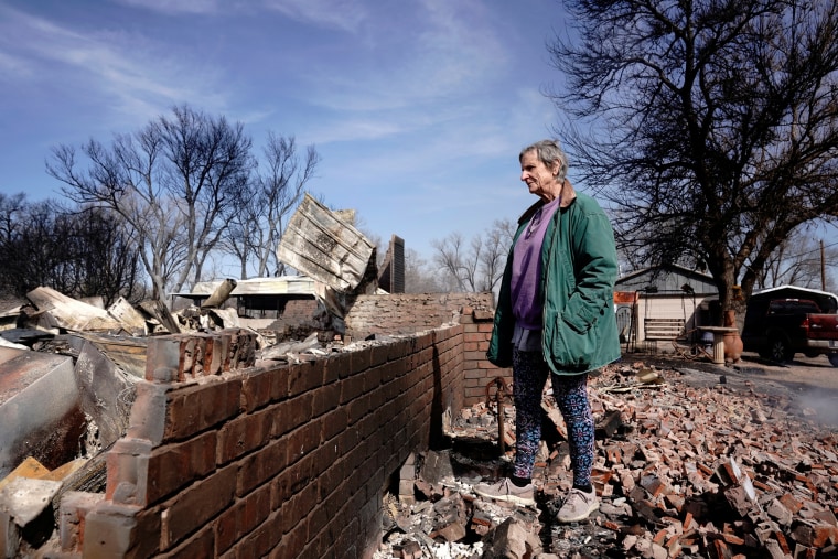 Gilissa Murray looks over her home that was destroyed by the Smokehouse Creek wildfire, in Canadian, Texas