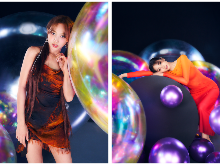 Bright photo shoot with TWICE members, Tzuyu and Nayeon posing with giant and small shaped balloons on a dark background