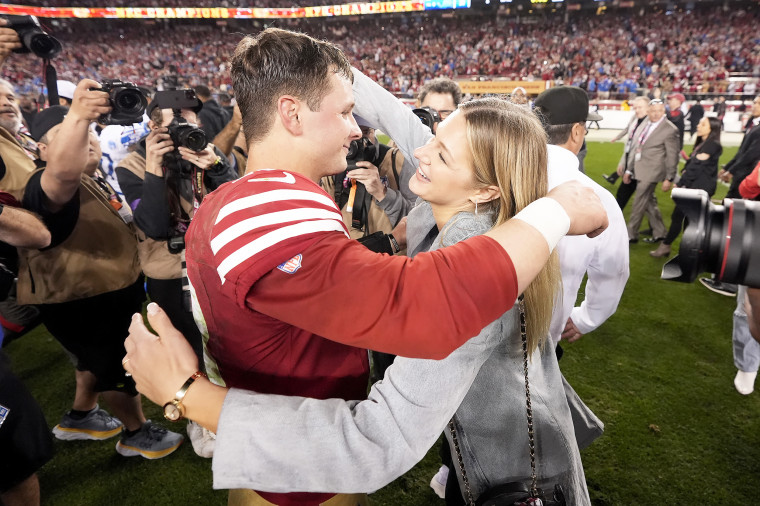 Brock Purdy hugs his fiancé, Jenna Brandt