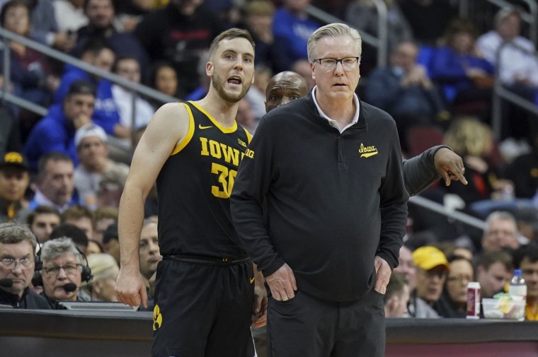 Connor McCaffery of the Iowa Hawkeyes talks to his head coach and father, Fran McCaffery, during the game against the Seton Hall Pirates at Prudential Center on Nov. 16, 2022 in Newark, NJ. 