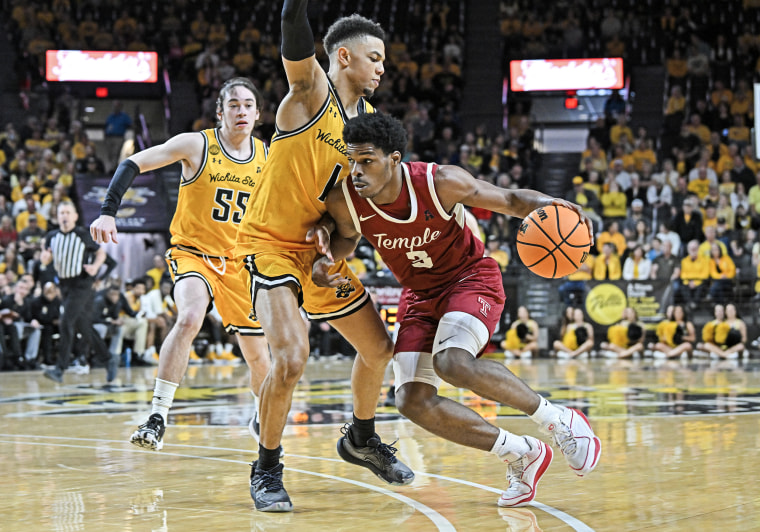 Hysier Miller #3 of the Temple Owls dribbles the ball against Xavier Bell #1 of the Wichita State Shockers in Wichita, Kansas on Feb. 25, 2024. 