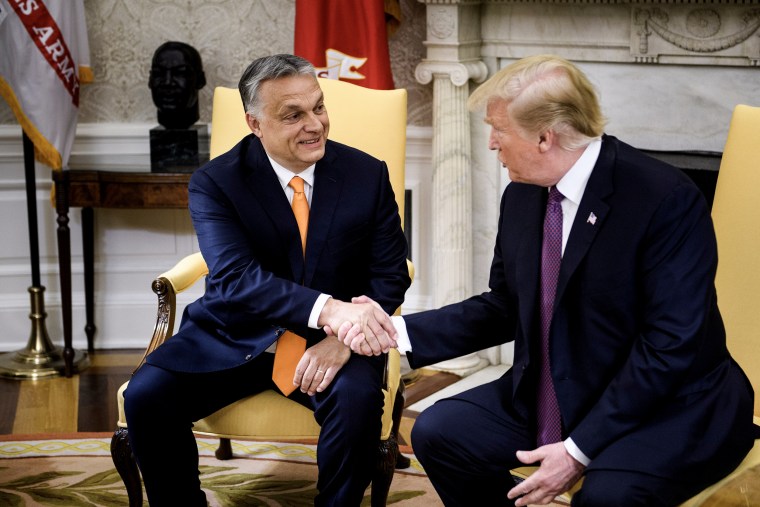 Hungary's Prime Minister Viktor Orban (L) and former US President Donald Trump shake hands in Washington, DC. on May 13, 2019. 