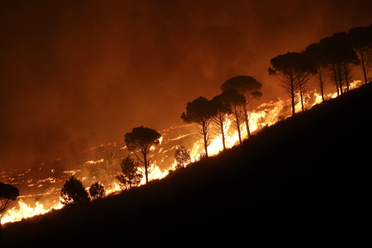 Wildfires spread through residential houses in Sicily, Italy on Sept. 23, 2023. 