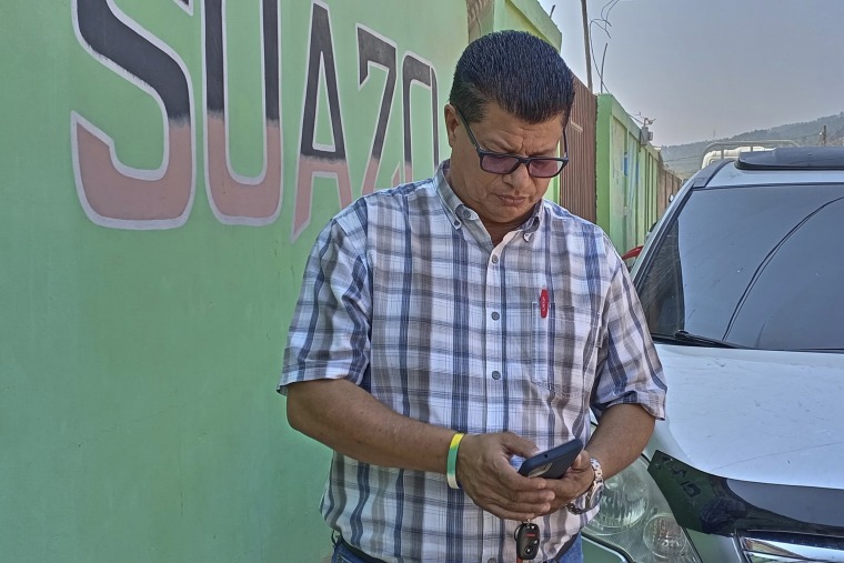 Martin Suazo Sandoval speaks with reporters outside his home in Azacualpa, Honduras