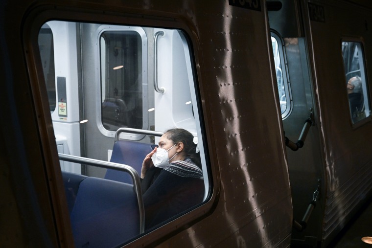 A passenger wears a mask while riding a train in Washington, D.C.