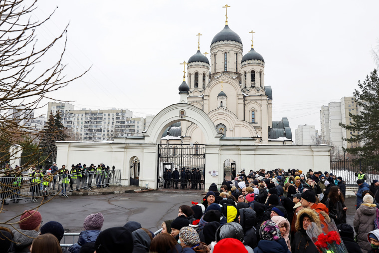 People gather outside the Soothe My Sorrows church as they wait for a funeral service and a farewell ceremony for Russian opposition politician Alexei Navalny in Moscow, Russia, March 1, 2024. 