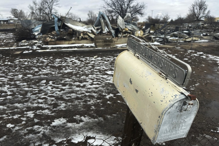 The wildfire spreading across the Texas Panhandle became the largest in state history Thursday, as a dusting of snow covered scorched grassland, dead cattle and burned out homes and gave firefighters a brief window of relief in desperate efforts to corral the blaze.