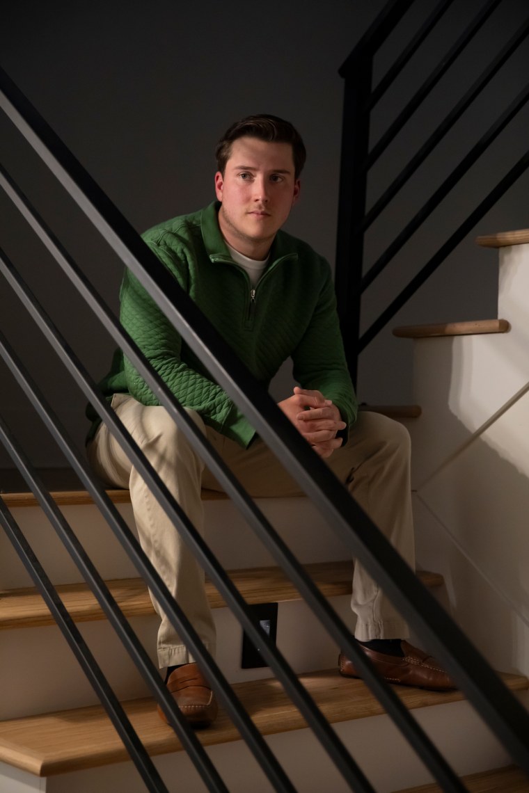 Jace Curry sits for a portrait on stairwell