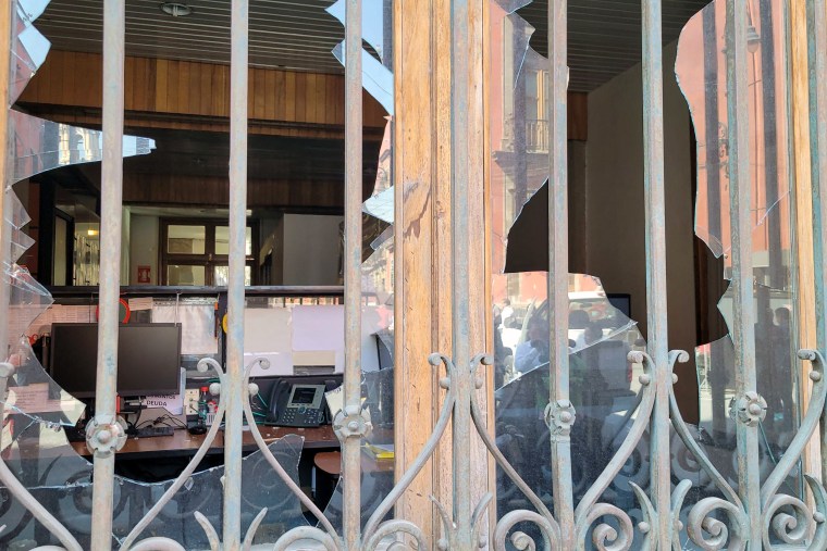 Broken windows of the presidential palace.