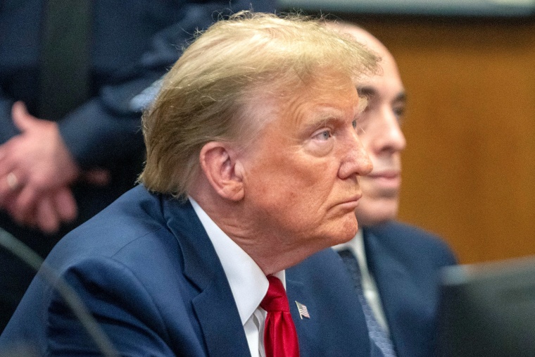 Donald  Trump sits in court.