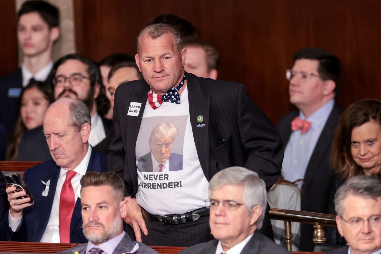 Image: Rep. Troy Nehls, R-Texas, wears a t-shirt with former President Donald Trump's mugshot printed on it at the State of the Union on Thursday.