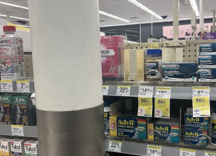 Barrier to access: Narcan in an Atlanta Walgreens was behind a large metal pole.
