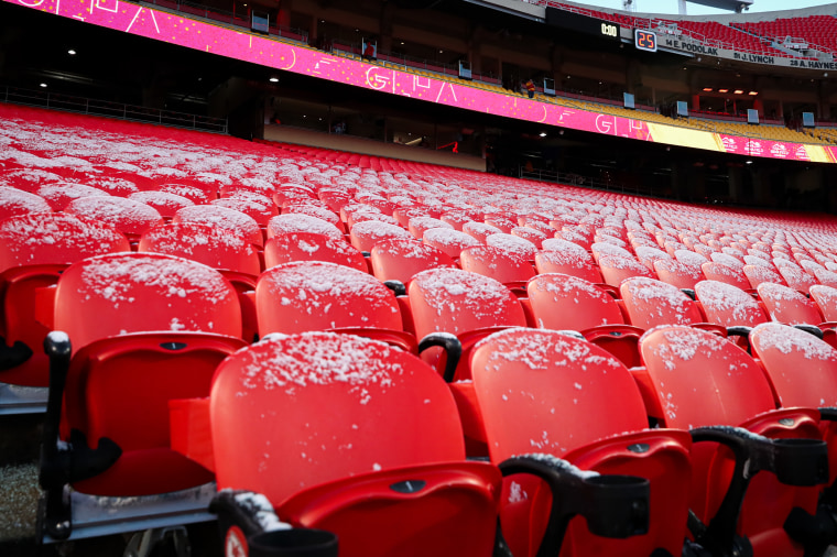 Snow covers the stadium seats 