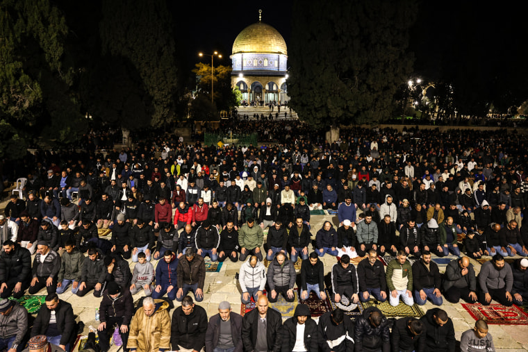 Image: Palestinian worshippers pray in front of the Dome of the Mosque at the al-Aqsa mosque