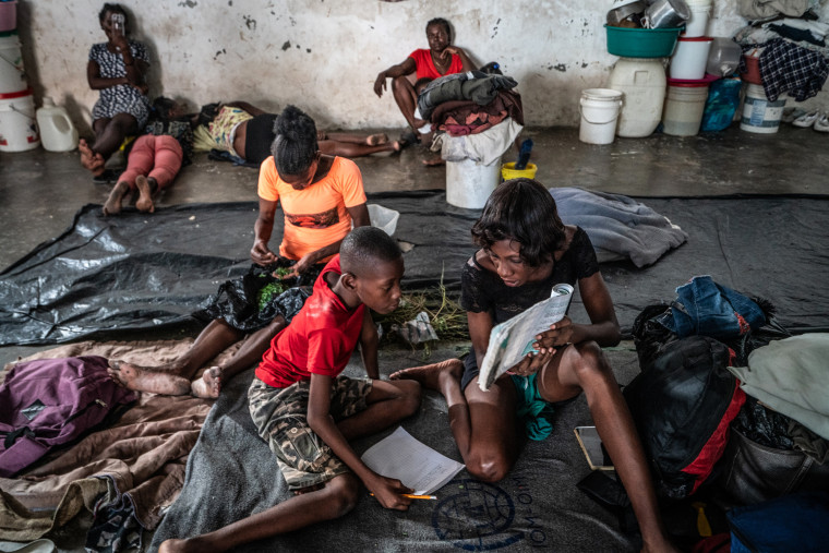Haitians take shelter in the Delmas 4 Olympic Boxing Arena