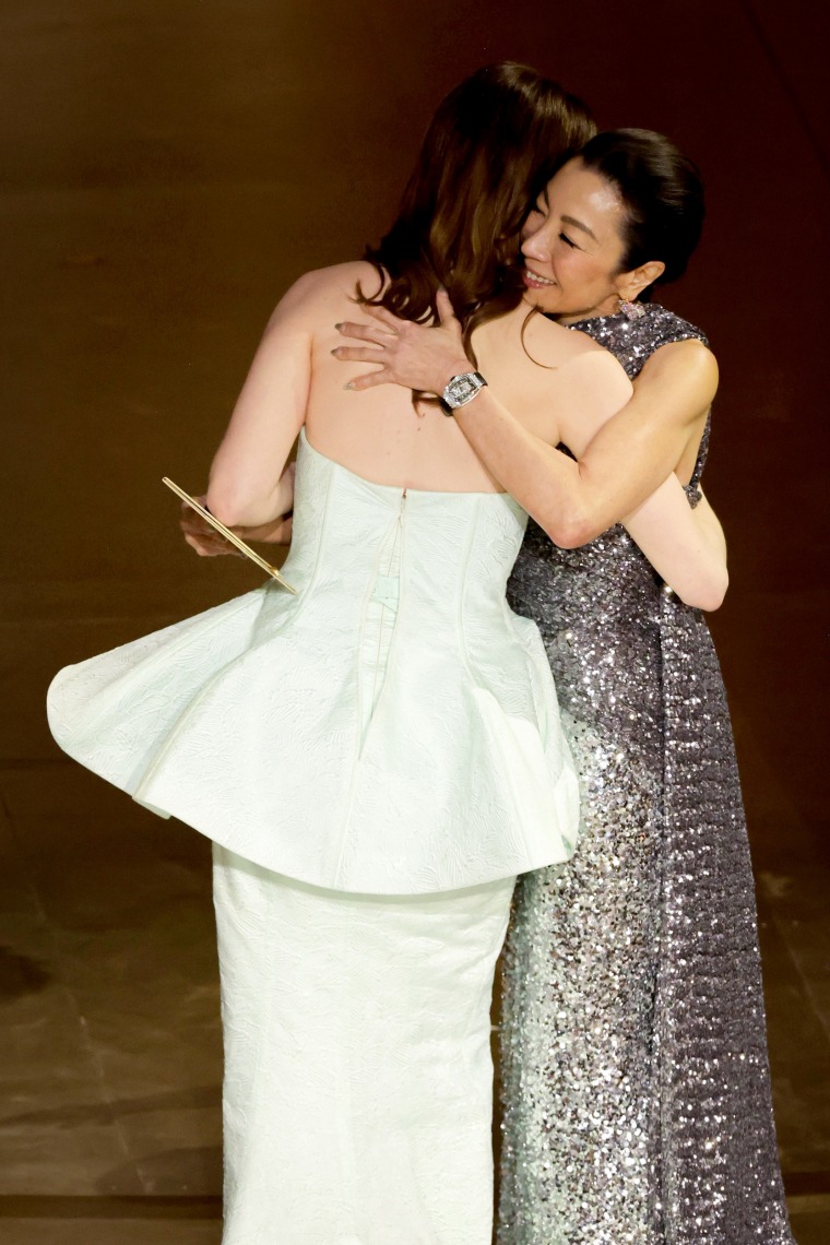 Emma Stone hugs Michelle Yeoh 