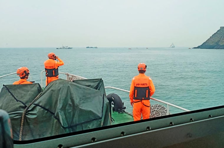 Members of Taiwan's coast guard work during a rescue operation after a boat capsized near Taiwan-controlled Kinmen islands