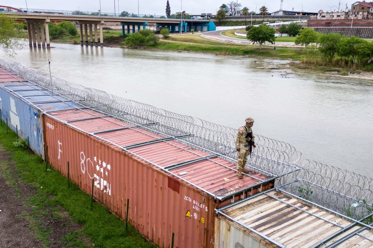 Image: BESTPIX - Panoramic View Of The Borderlands: Southwestern U.S. And Mexico security border patrol razol wire shipping containers